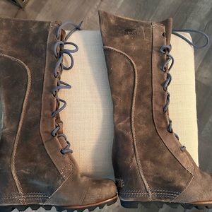 Sorel tall wedge laced waterproof leather boots.